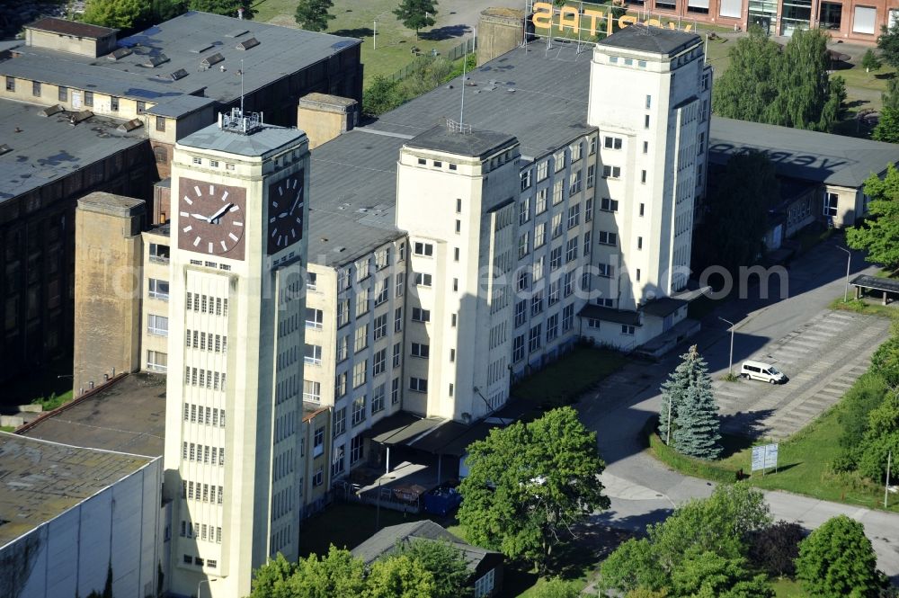 Aerial photograph Wittenberge - View of the abandoned buildings of the former Veritas at the Bad Wilsnacker street in Wittenberg in the state of Brandenburg. After the dismantling of the singer-plant production under the name Veritas was continued. The clock tower of the former Singer sewing machine factory / Veritas in Wittenberg Germany is the largest and second largest clock tower in Europe