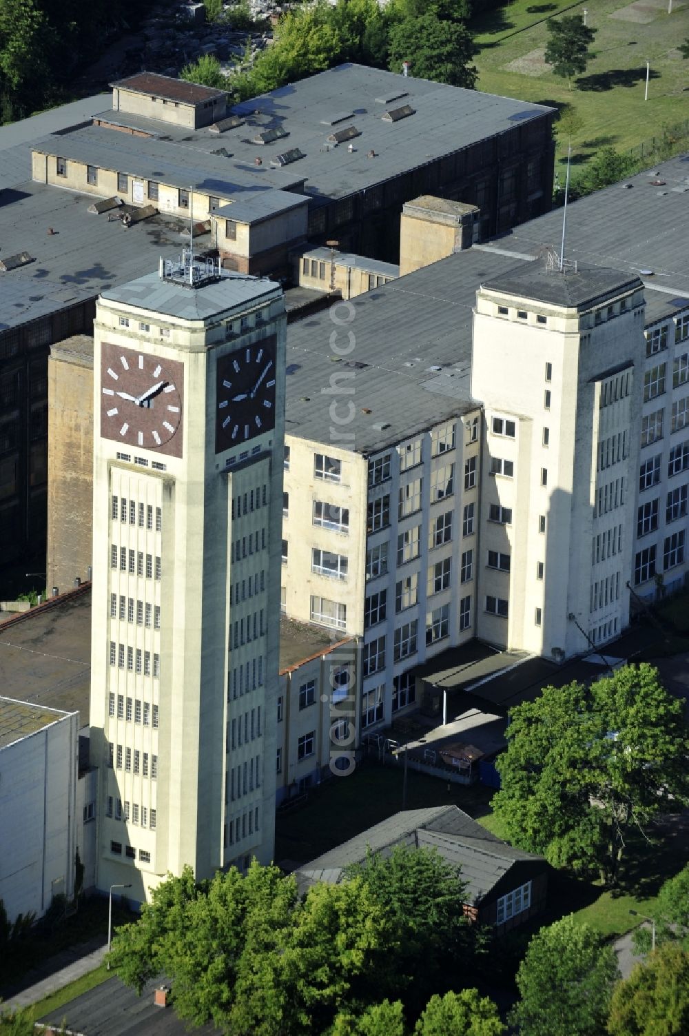 Wittenberge from above - View of the abandoned buildings of the former Veritas at the Bad Wilsnacker street in Wittenberg in the state of Brandenburg. After the dismantling of the singer-plant production under the name Veritas was continued. The clock tower of the former Singer sewing machine factory / Veritas in Wittenberg Germany is the largest and second largest clock tower in Europe