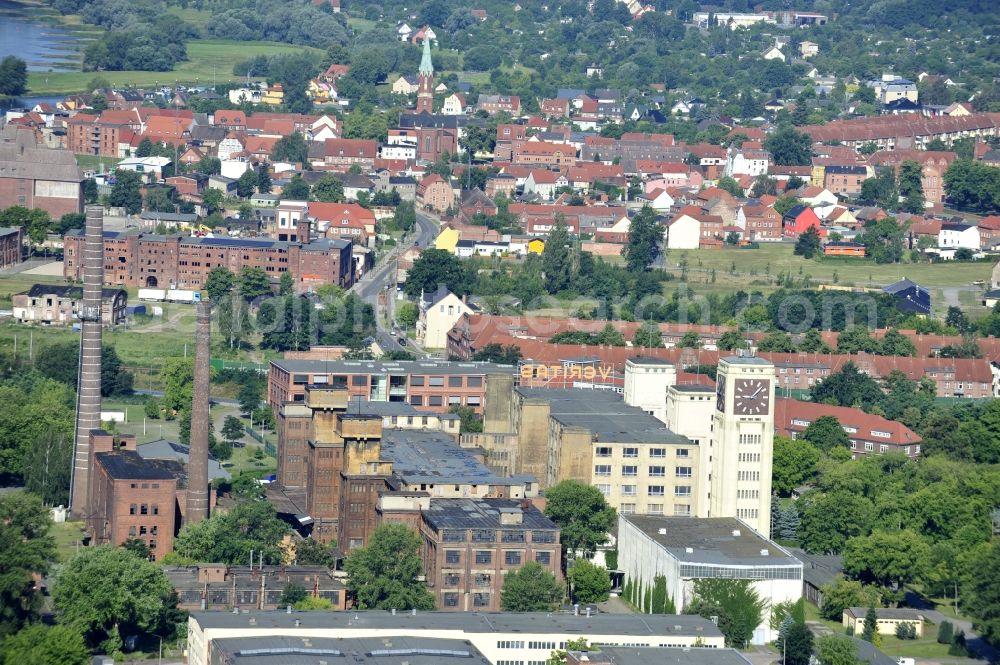 Aerial image Wittenberge - View of the abandoned buildings of the former Veritas at the Bad Wilsnacker street in Wittenberg in the state of Brandenburg. After the dismantling of the singer-plant production under the name Veritas was continued. The clock tower of the former Singer sewing machine factory / Veritas in Wittenberg Germany is the largest and second largest clock tower in Europe