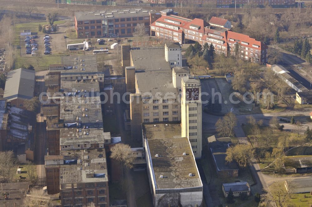 Wittenberge from the bird's eye view: View of the abandoned buildings of the former Veritas at the Bad Wilsnacker street in Wittenberg in the state of Brandenburg. After the dismantling of the singer-plant production under the name Veritas was continued. The clock tower of the former Singer sewing machine factory / Veritas in Wittenberg Germany is the largest and second largest clock tower in Europe