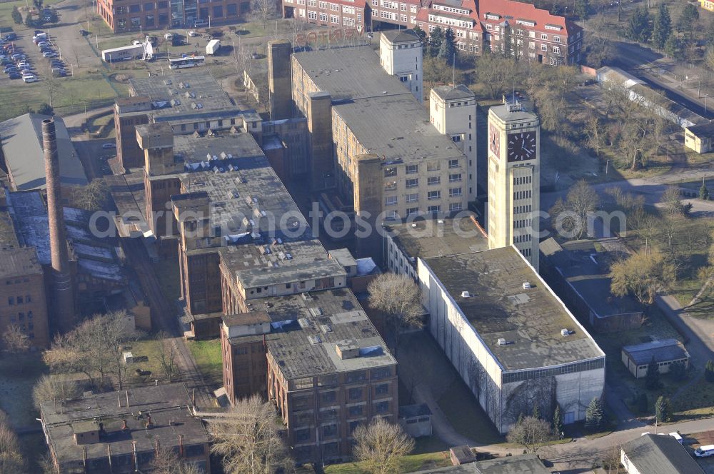 Aerial image Wittenberge - View of the abandoned buildings of the former Veritas at the Bad Wilsnacker street in Wittenberg in the state of Brandenburg. After the dismantling of the singer-plant production under the name Veritas was continued. The clock tower of the former Singer sewing machine factory / Veritas in Wittenberg Germany is the largest and second largest clock tower in Europe