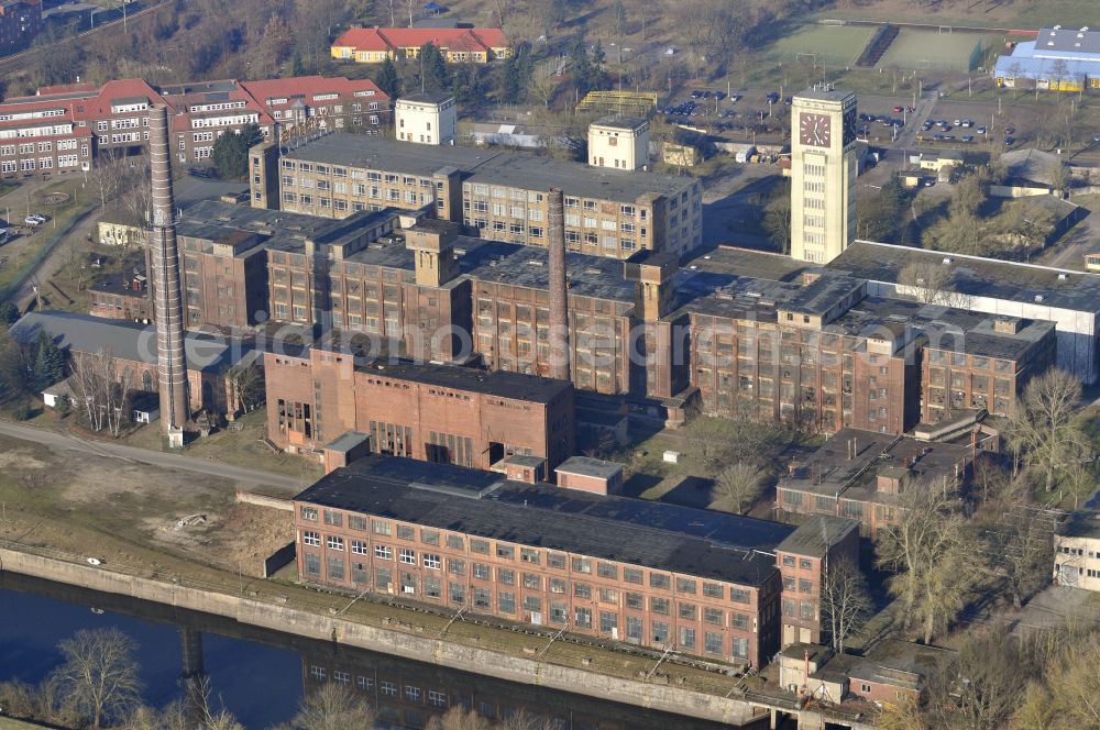 Wittenberge from above - View of the abandoned buildings of the former Veritas at the Bad Wilsnacker street in Wittenberg in the state of Brandenburg. After the dismantling of the singer-plant production under the name Veritas was continued. The clock tower of the former Singer sewing machine factory / Veritas in Wittenberg Germany is the largest and second largest clock tower in Europe