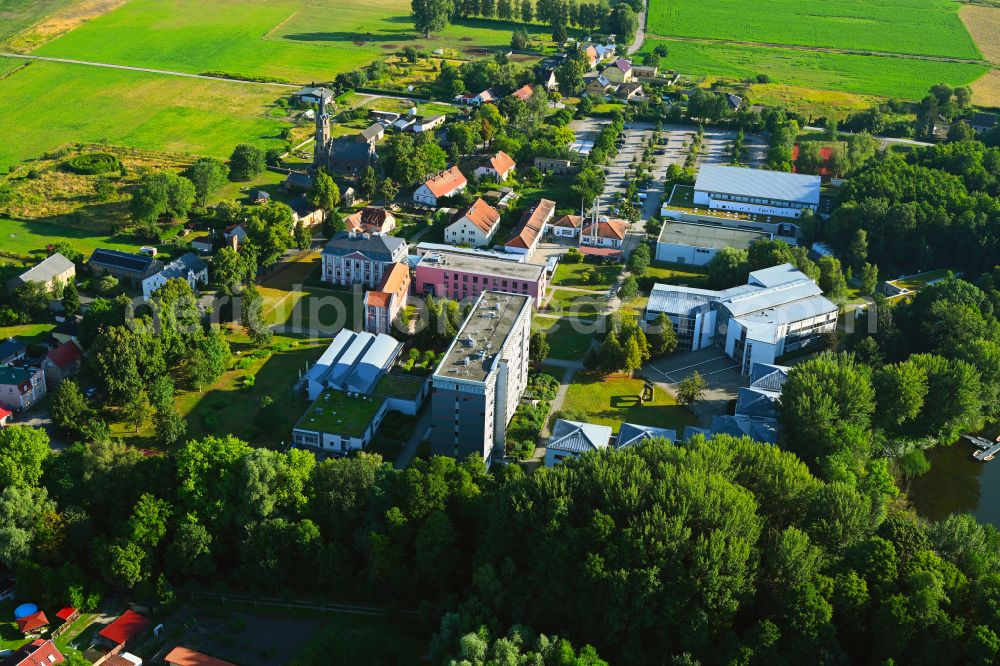 Plessow from the bird's eye view: Building complex of the education and training center Bildungszentrum of Bundesfinanzverwaltung on street Plessower Hauptstrasse in Plessow in the state Brandenburg, Germany