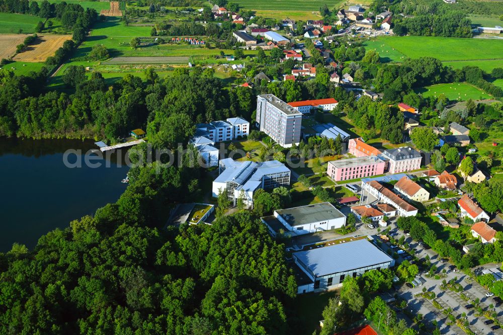 Aerial photograph Plessow - Building complex of the education and training center Bildungszentrum of Bundesfinanzverwaltung on street Plessower Hauptstrasse in Plessow in the state Brandenburg, Germany