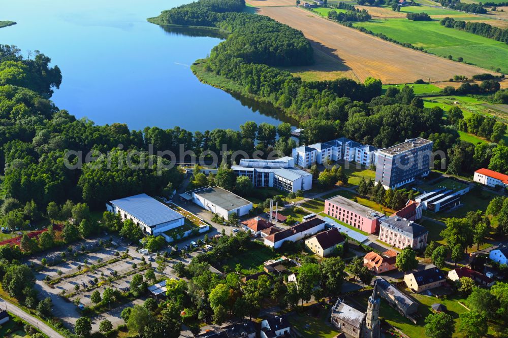 Plessow from the bird's eye view: Building complex of the education and training center Bildungszentrum of Bundesfinanzverwaltung on street Plessower Hauptstrasse in Plessow in the state Brandenburg, Germany