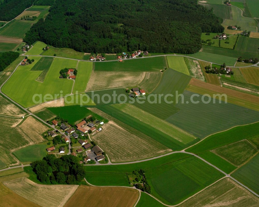 Aicha from the bird's eye view: Homestead and farm outbuildings on the edge of agricultural fields in Aicha in the state Bavaria, Germany