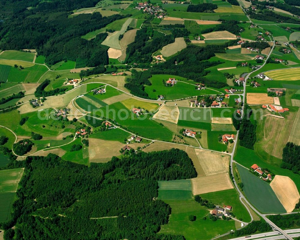 Degernbach from above - Homestead and farm outbuildings on the edge of agricultural fields in Degernbach in the state Bavaria, Germany