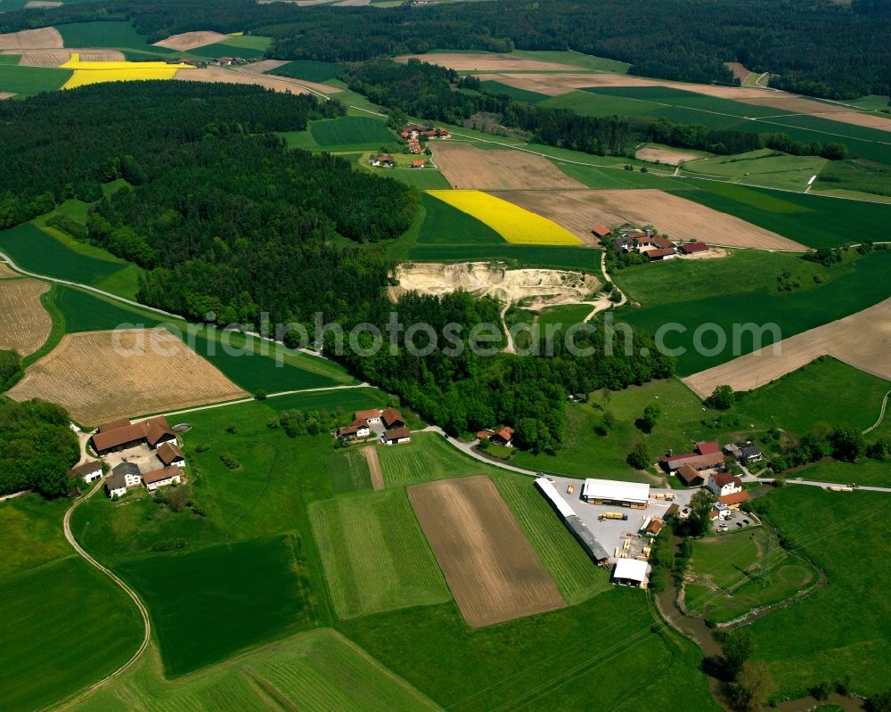 Holzham from above - Homestead and farm outbuildings on the edge of agricultural fields in Holzham in the state Bavaria, Germany