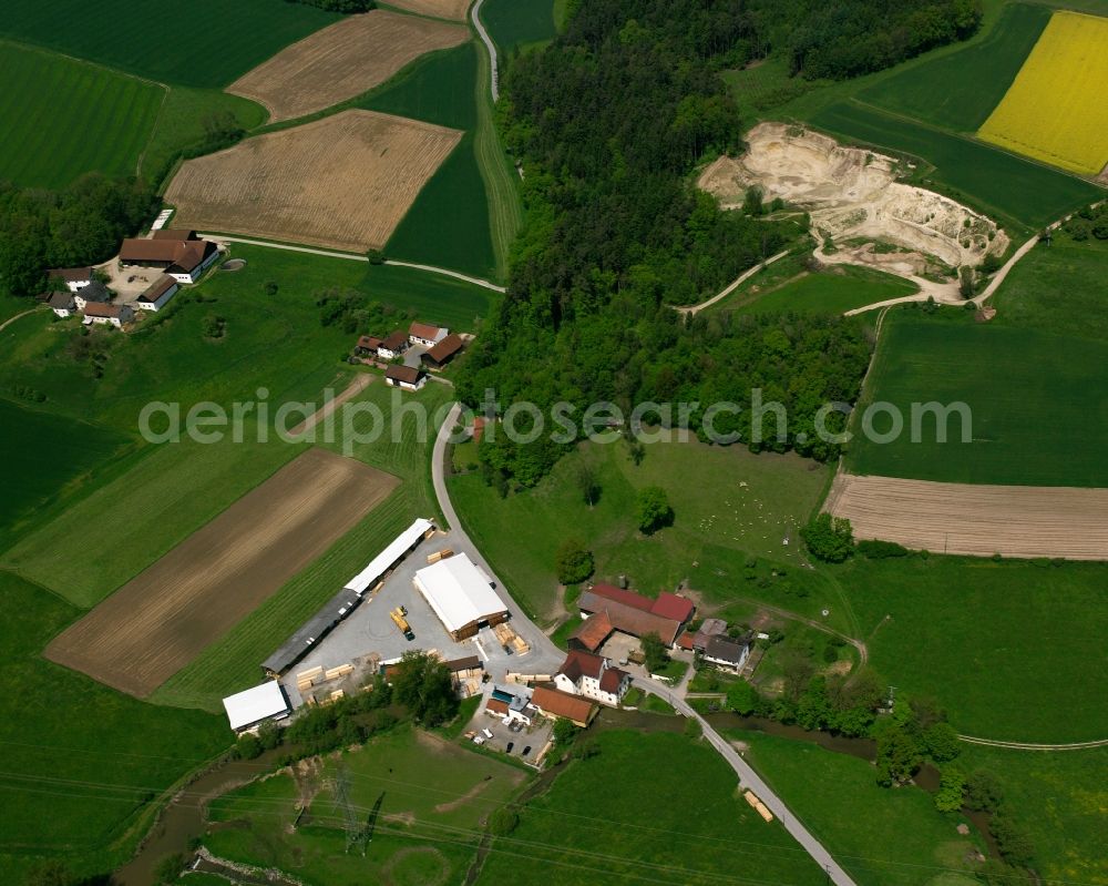 Holzham from the bird's eye view: Homestead and farm outbuildings on the edge of agricultural fields in Holzham in the state Bavaria, Germany