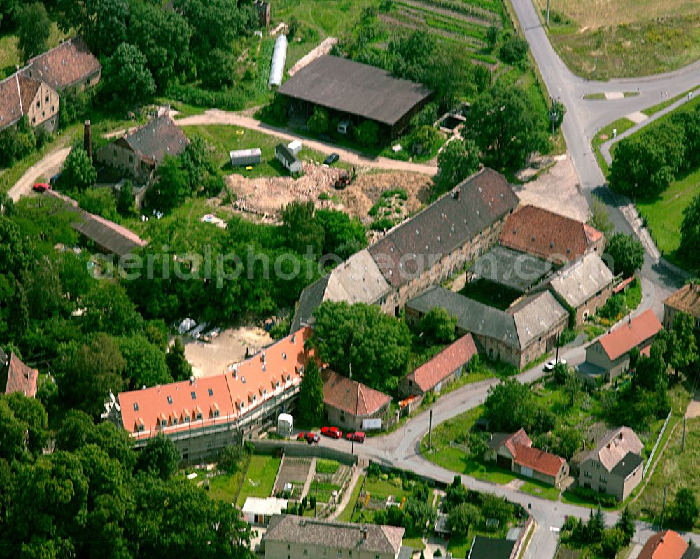 Aerial image Jahnishausen - Homestead and farm outbuildings on the edge of agricultural fields in Jahnishausen in the state Saxony, Germany