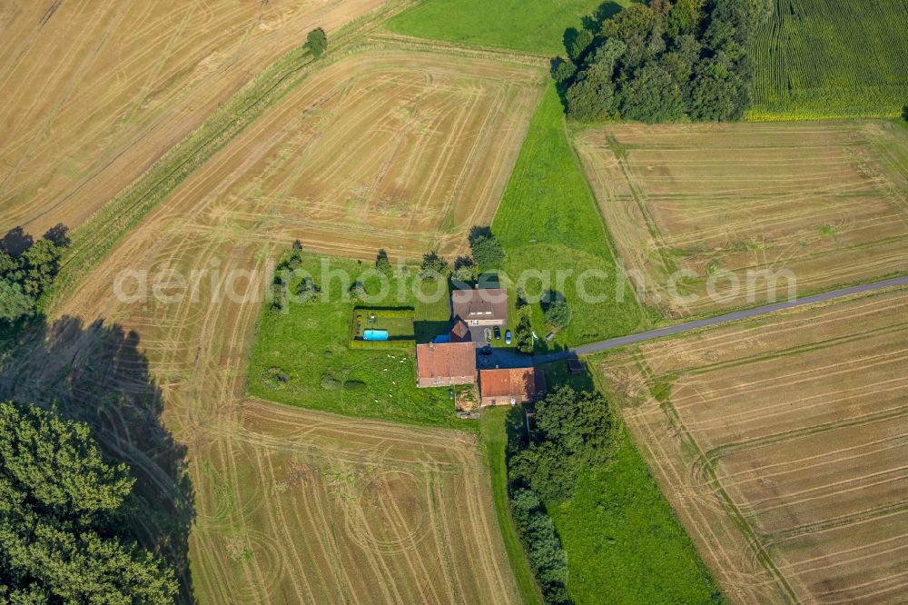 Aerial image Roland - Homestead and farm outbuildings on the edge of agricultural fields in Roland in the state North Rhine-Westphalia, Germany