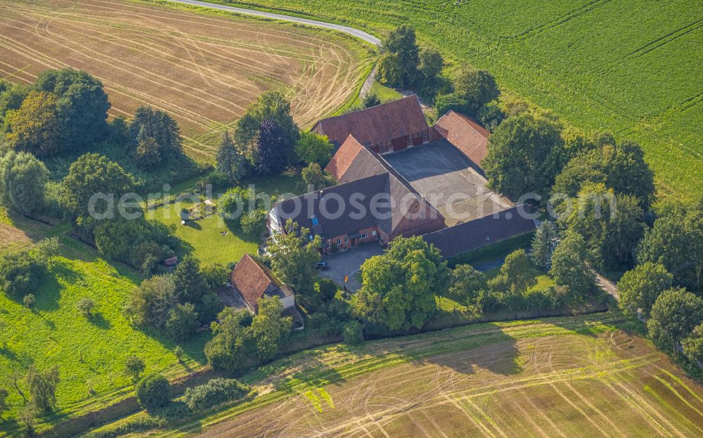 Roland from above - Homestead and farm outbuildings on the edge of agricultural fields in Roland in the state North Rhine-Westphalia, Germany