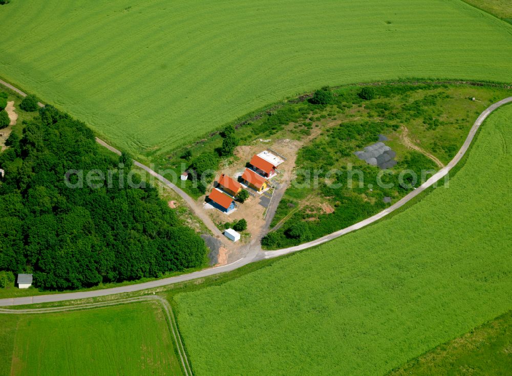 Schönborn from the bird's eye view: Homestead and farm outbuildings on the edge of agricultural fields in Schönborn in the state Rhineland-Palatinate, Germany