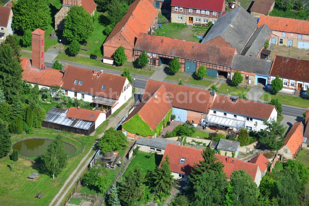 Aerial photograph Wohlenberg - Homestead and farm outbuildings on the edge of agricultural fields on street L9 in Wohlenberg in the Altmark in the state Saxony-Anhalt, Germany