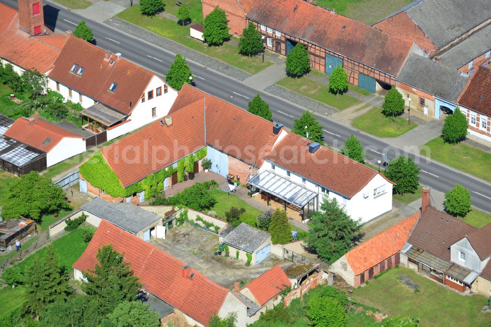 Wohlenberg from above - Homestead and farm outbuildings on the edge of agricultural fields on street L9 in Wohlenberg in the Altmark in the state Saxony-Anhalt, Germany