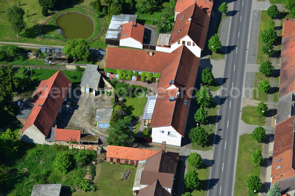 Aerial image Wohlenberg - Homestead and farm outbuildings on the edge of agricultural fields on street L9 in Wohlenberg in the Altmark in the state Saxony-Anhalt, Germany