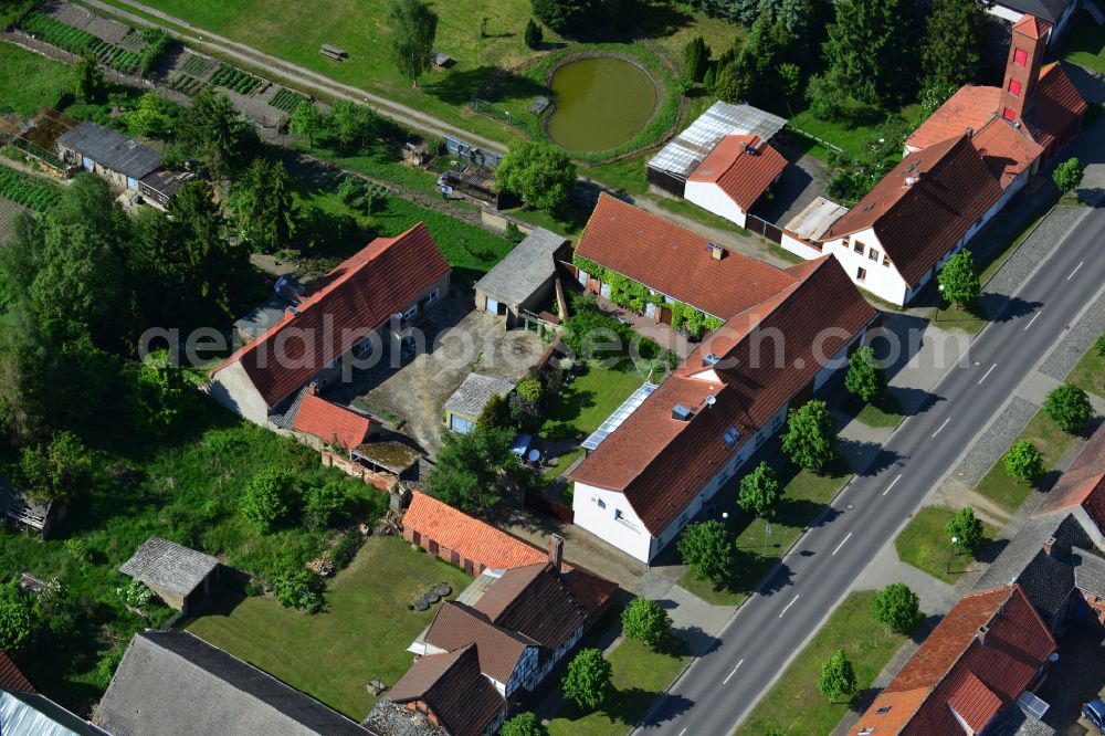 Aerial photograph Wohlenberg - Homestead and farm outbuildings on the edge of agricultural fields on street L9 in Wohlenberg in the Altmark in the state Saxony-Anhalt, Germany