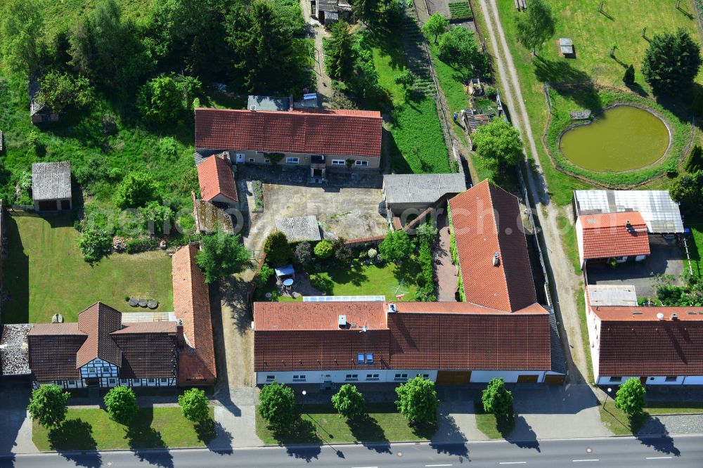 Wohlenberg from above - Homestead and farm outbuildings on the edge of agricultural fields on street L9 in Wohlenberg in the Altmark in the state Saxony-Anhalt, Germany