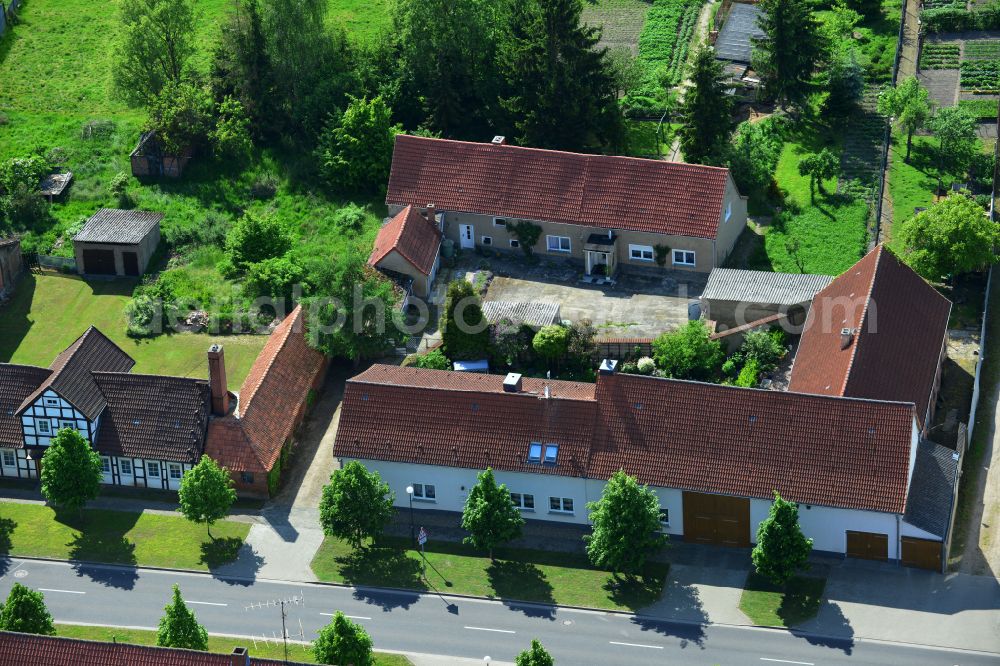 Aerial image Wohlenberg - Homestead and farm outbuildings on the edge of agricultural fields on street L9 in Wohlenberg in the Altmark in the state Saxony-Anhalt, Germany