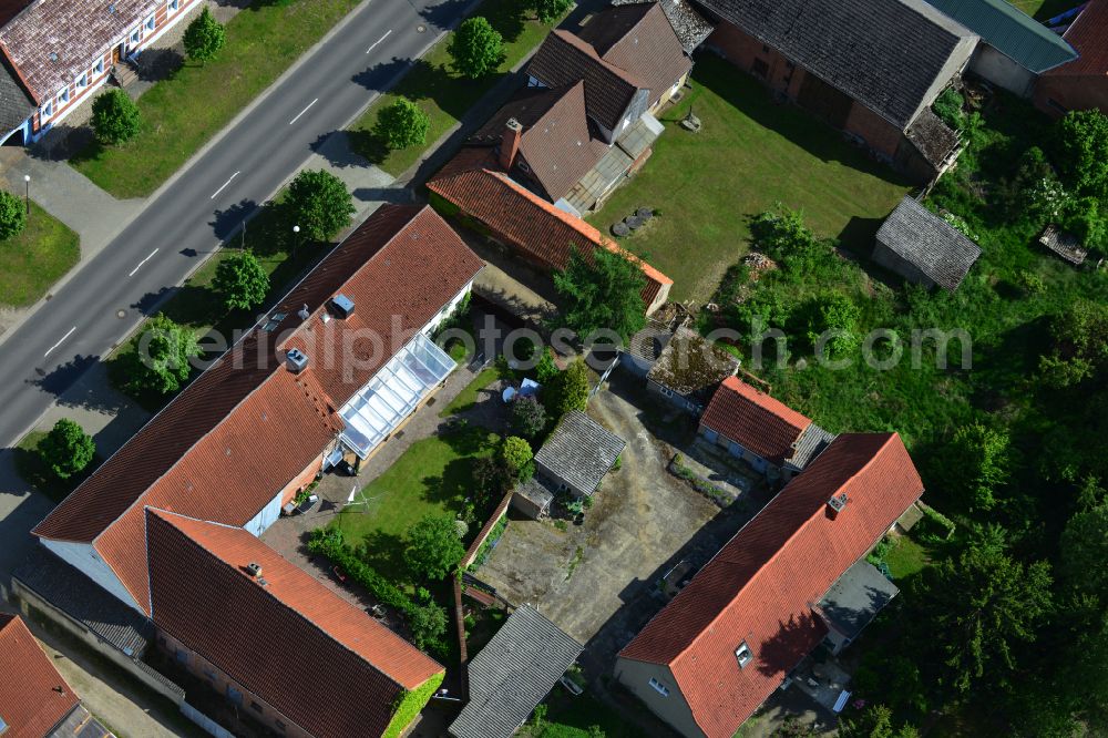 Aerial photograph Wohlenberg - Homestead and farm outbuildings on the edge of agricultural fields on street L9 in Wohlenberg in the Altmark in the state Saxony-Anhalt, Germany