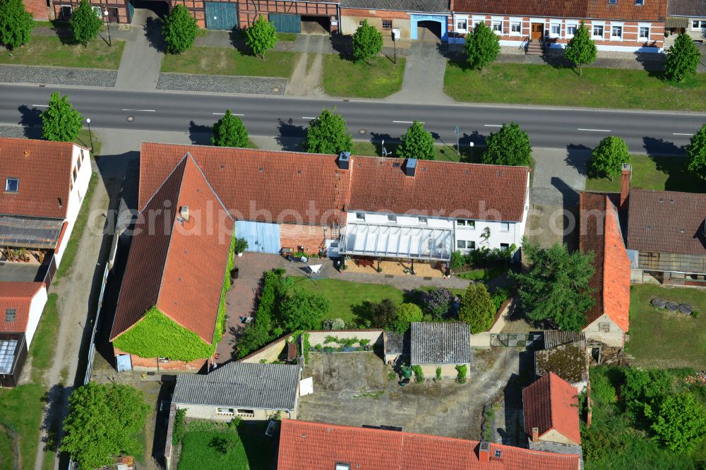 Wohlenberg from above - Homestead and farm outbuildings on the edge of agricultural fields on street L9 in Wohlenberg in the Altmark in the state Saxony-Anhalt, Germany