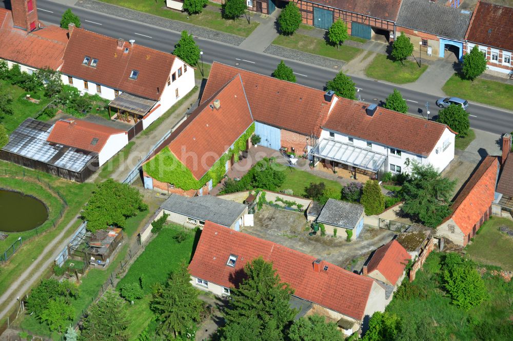 Aerial image Wohlenberg - Homestead and farm outbuildings on the edge of agricultural fields on street L9 in Wohlenberg in the Altmark in the state Saxony-Anhalt, Germany