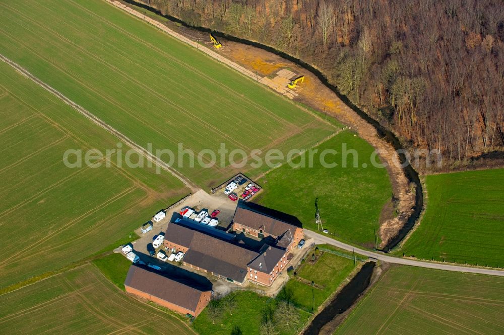 Aerial image Rheurdt - Farm on Landwehrbach creek and a forest in Rheurdt in the state of North Rhine-Westphalia