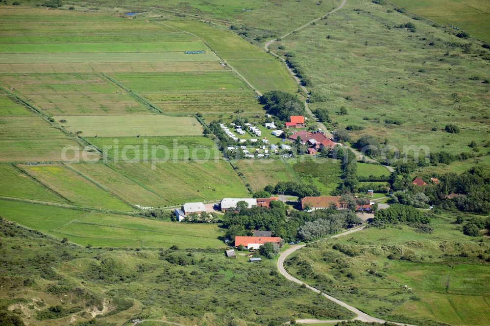 Aerial photograph Borkum - Farm on the edge of cultivated green fields with campground in Borkum in the state Lower Saxony