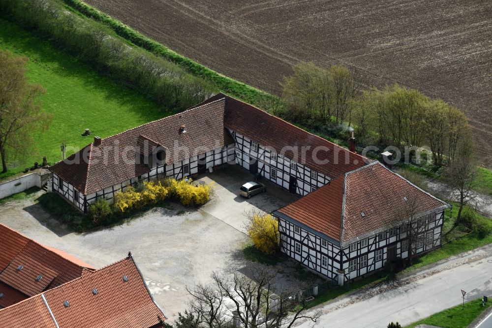 Hahausen from the bird's eye view: Farm on the edge of cultivated fields in Hahausen in the state Lower Saxony