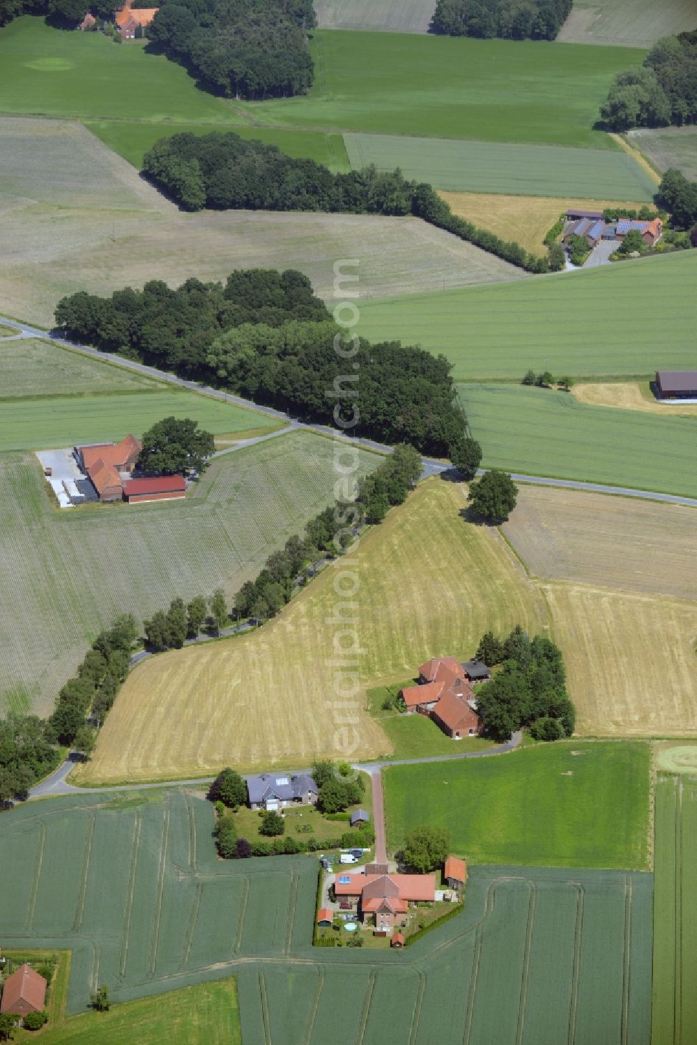 Herzebrock-Clarholz from the bird's eye view: Farm on the edge of cultivated fields in Herzebrock-Clarholz in the state North Rhine-Westphalia