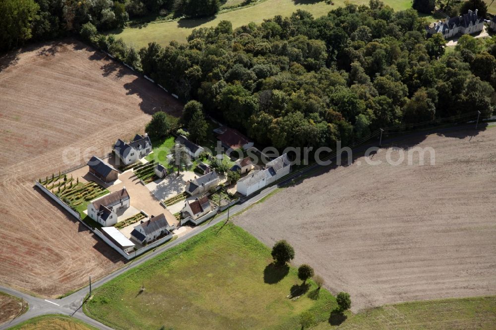 Huismes from the bird's eye view: Farm on the edge of cultivated fields in Huismes in Centre-Val de Loire, France