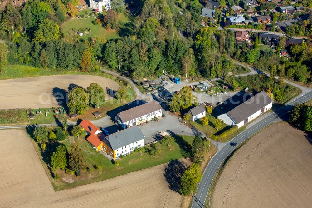 Aerial photograph Meschede - Farm on the edge of cultivated fields in Meschede in the state North Rhine-Westphalia