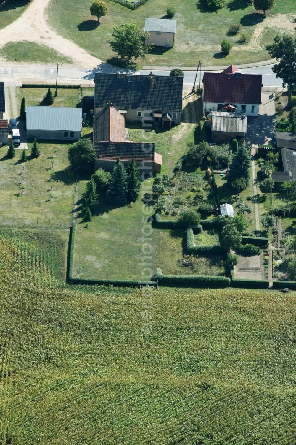 Aerial photograph Parmen Nordwestuckermark - Farm on the edge of cultivated fields in Parmen - Nordwestuckermark in the state Brandenburg