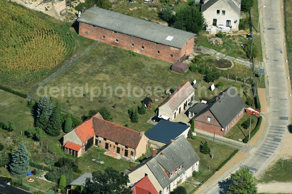 Aerial photograph Parmen Nordwestuckermark - Farm on the edge of cultivated fields in Parmen - Nordwestuckermark in the state Brandenburg