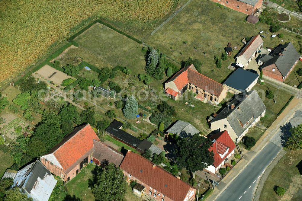 Parmen Nordwestuckermark from the bird's eye view: Farm on the edge of cultivated fields in Parmen - Nordwestuckermark in the state Brandenburg