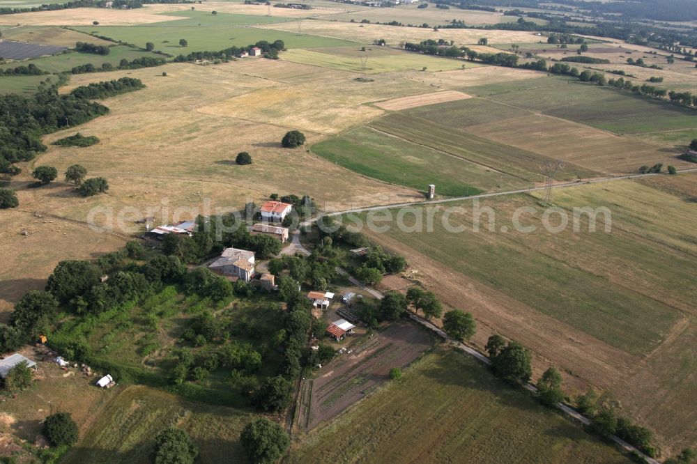 Torre Alfina from above - Farm on the edge of cultivated fields in Torre Alfina in Italy