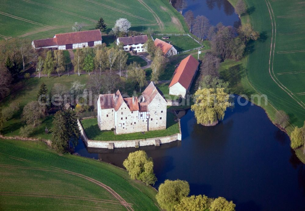 Aerial image Sulzdorf an der Lederhecke - Farm and water mill on the edge of cultivated fields and milling lake in the district Schwanhausen in Sulzdorf an der Lederhecke in the state Bavaria