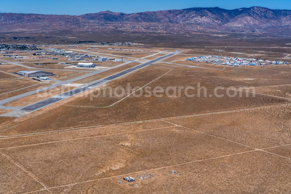 Mojave from above - Runway with hangar taxiways and terminals on the grounds of the airport Mojave Air & Space Port on street Sabovich Street in Mojave in California, United States of America