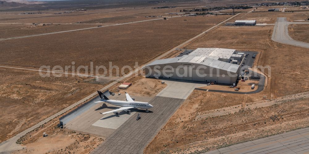 Mojave from above - Runway with hangar taxiways and terminals on the grounds of the airport Mojave Air & Space Port on street Sabovich Street in Mojave in California, United States of America