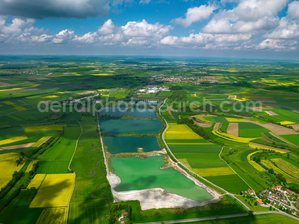 Binzwangen from above - Yellow - green contrast of blooming rapeseed flowers on field stripes in Binzwangen in the state Baden-Wuerttemberg, Germany