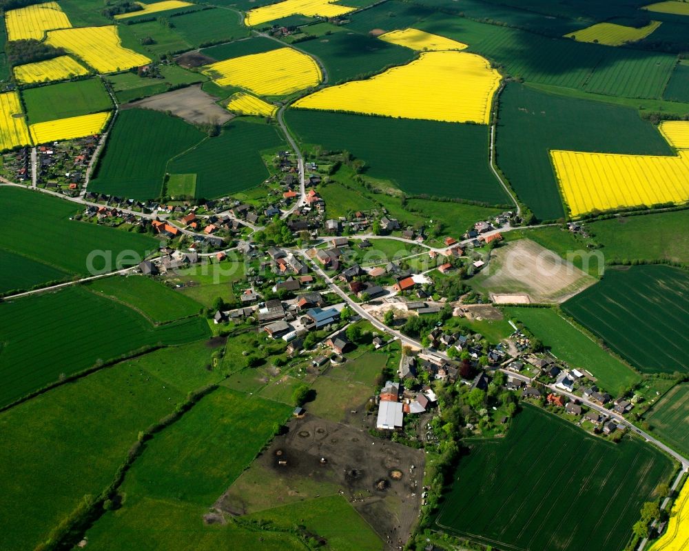 Aerial photograph Klinkrade - Yellow - green contrast of blooming rapeseed flowers on field stripes in Klinkrade in the state Schleswig-Holstein, Germany