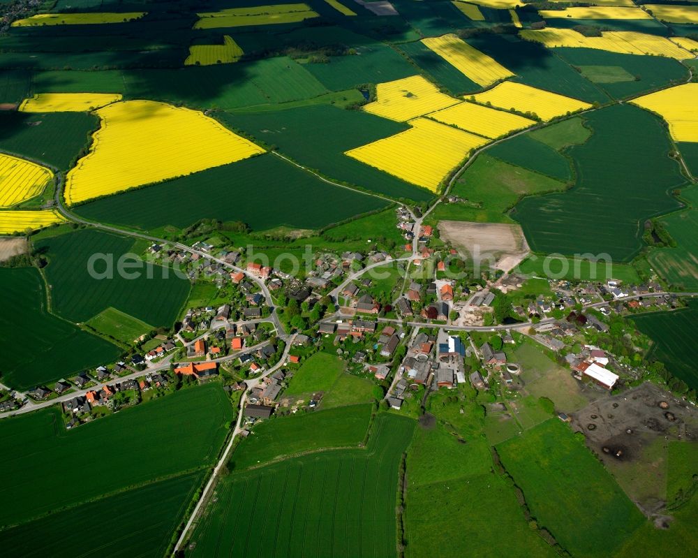 Klinkrade from above - Yellow - green contrast of blooming rapeseed flowers on field stripes in Klinkrade in the state Schleswig-Holstein, Germany