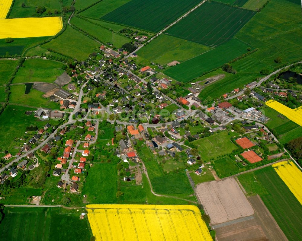 Kollow from the bird's eye view: Yellow - green contrast of blooming rapeseed flowers on field stripes in Kollow in the state Schleswig-Holstein, Germany