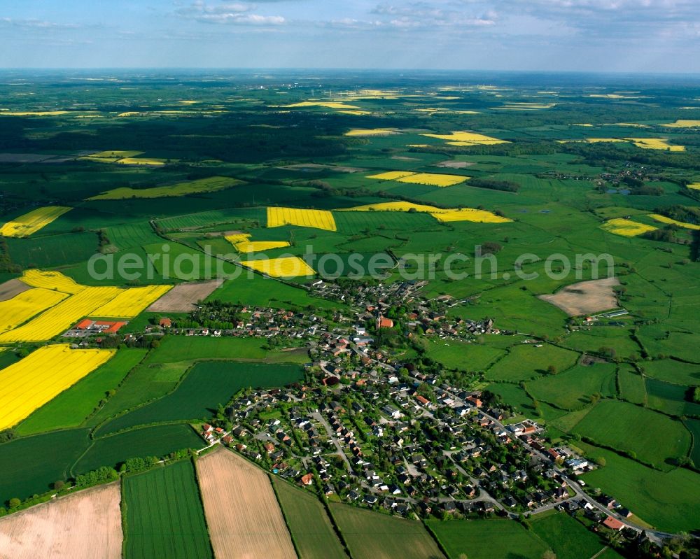 Sandesneben from above - Yellow - green contrast of blooming rapeseed flowers on field stripes in Sandesneben in the state Schleswig-Holstein, Germany