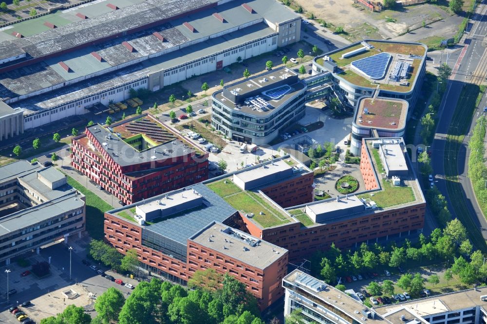 Leipzig from the bird's eye view: Compound of the Alte Messe (Old Exhibition) in Leipzig in the state of Saxony. The distinct red building located on Perlickstrasse is the Bio Cube Leipzig and located next to the Old Messe Leipzig. It belongs to the complex of Bio City Leipzig and includes laboratories and offices. The large hall is the old exhibition centre, several shopping facilities and stores are located on site as well