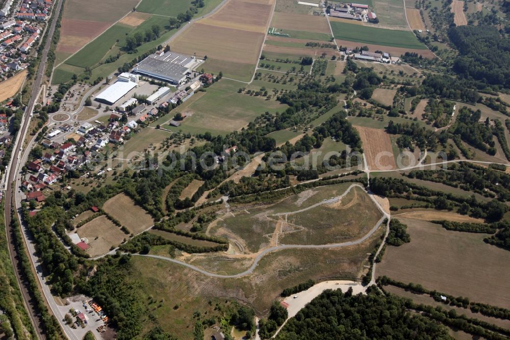 Aerial photograph Renningen- Malmsheim - Site of former landfill in Renningen in the state Baden-Wuerttemberg. Site of the heaped garbage dump in Renningen in Baden-Wuerttemberg. The lookout on the former soil depot Malmsheim provides a wide panorama over the Rankbachtal with its natural floodplain meadows and surrounding landscape with its colorful mosaic of fields, semi-arid grassland, hedges and forests