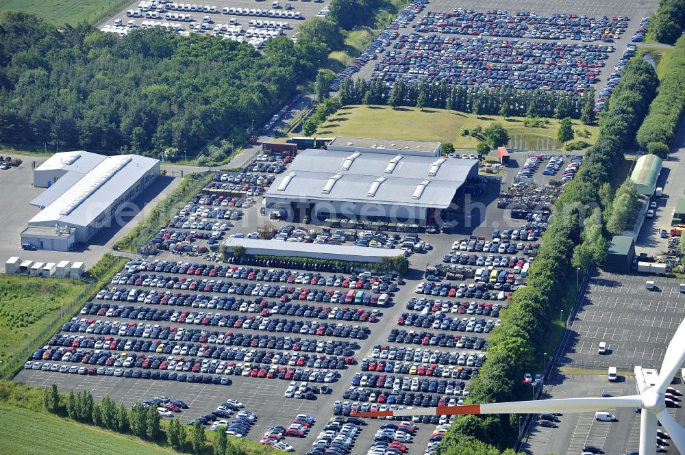 Aerial image Etzin - Gelände der Auto- Service-und Umschlag- Center Mosolf GmbH in Etzin bei Nauen. Die Firma besteht seit über 50 Jahren und bietet außer Logistikdienstleistungen, Kraftfahrzeugvermietung und -verkauf, ebenso Technik-, Prüfungs- und Ausstattungsdienste an. Site of the auto service center and transshipment Mosolf GmbH Etzin at Nauen. The company was founded over 50 years and in addition to logistics services, vehicle rental and sale, as well engineering, testing and equipment services.