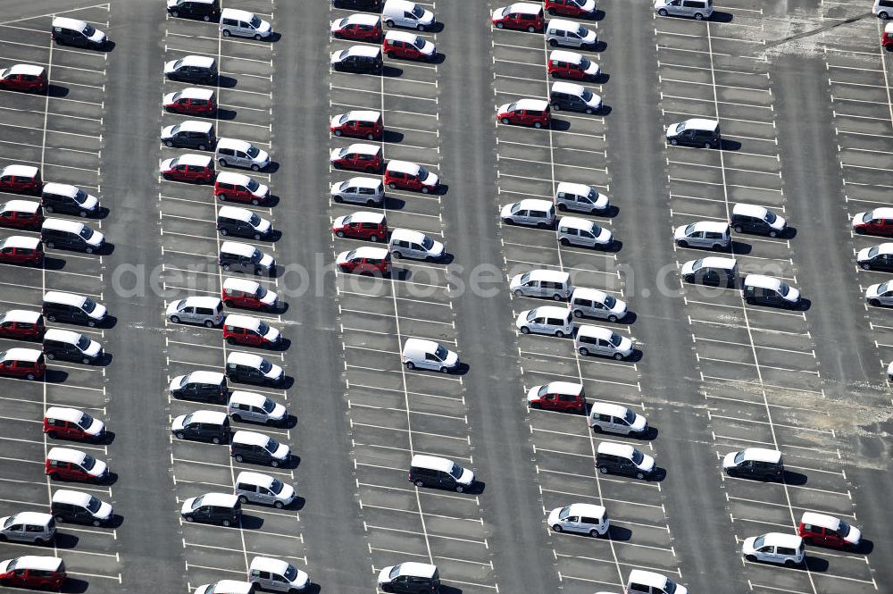 Etzin from the bird's eye view: Gelände der Auto- Service-und Umschlag- Center Mosolf GmbH in Etzin bei Nauen. Die Firma besteht seit über 50 Jahren und bietet außer Logistikdienstleistungen, Kraftfahrzeugvermietung und -verkauf, ebenso Technik-, Prüfungs- und Ausstattungsdienste an. Site of the auto service center and transshipment Mosolf GmbH Etzin at Nauen. The company was founded over 50 years and in addition to logistics services, vehicle rental and sale, as well engineering, testing and equipment services.