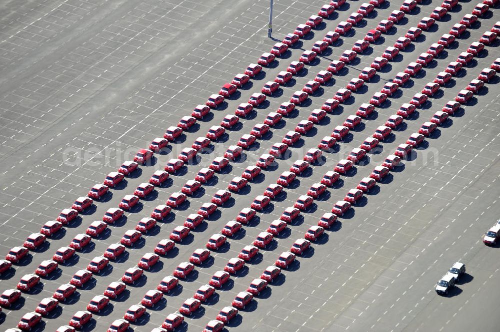 Etzin from the bird's eye view: Gelände der Auto- Service-und Umschlag- Center Mosolf GmbH in Etzin bei Nauen. Die Firma besteht seit über 50 Jahren und bietet außer Logistikdienstleistungen, Kraftfahrzeugvermietung und -verkauf, ebenso Technik-, Prüfungs- und Ausstattungsdienste an. Site of the auto service center and transshipment Mosolf GmbH Etzin at Nauen. The company was founded over 50 years and in addition to logistics services, vehicle rental and sale, as well engineering, testing and equipment services.