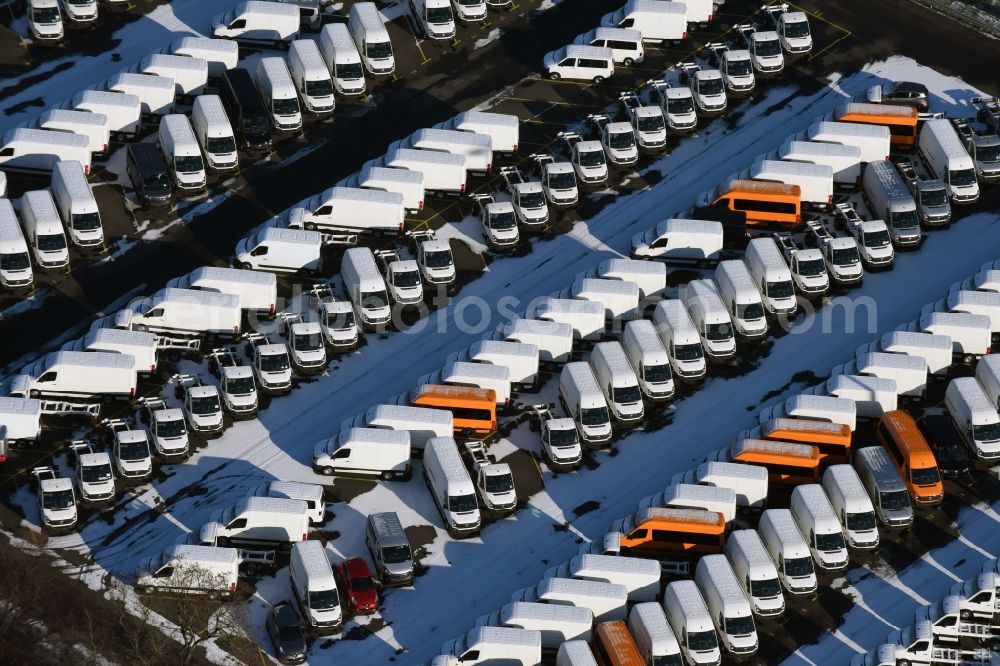 Ketzin from above - Wintry snowy site of the auto service center and transshipment Mosolf GmbH Etzin. The company in addition to logistics services, vehicle rental and sale, as well engineering, testing and equipment services